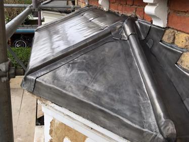 Renewed bay roof with new code 5 lead after we removed all the existing coverings at a residential property in Barnes, London