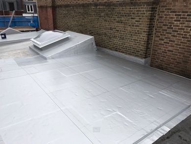 Renewed roof & new access hatch, covered by carrier membrane on new WBP ply & flat board insulation & liquid membrane over