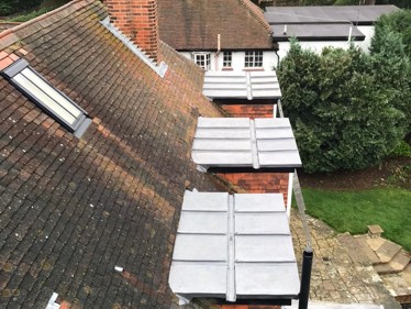Renewed bay roofs with new code 5 lead after we removed all the existing coverings at a residential property in Epsom, Surrey