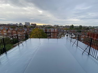 Renewed flat roof with Sikalastic 625 liquid coating, completely seamless & guaranteed to waterproof & protect this flat roof