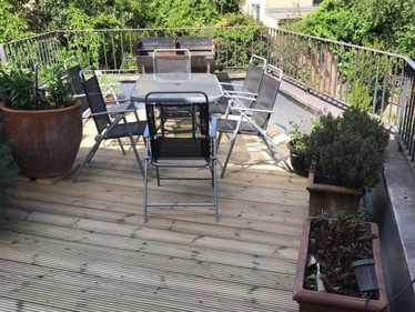 Renewed roof garden timber deck fixed to new timber framework on support pads after laying Sikalastic 625 coating on new ply