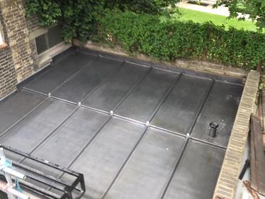 New Code 7 lead roof replacing old lead roof at a property in Victoria, London