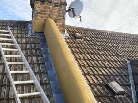 New render and lead flashing to firewall and chimney stack