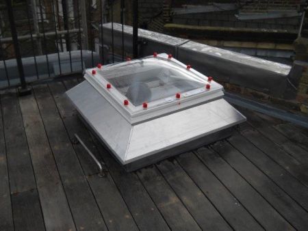 Domed roof light fitted to flat roof letting light shine and adding value to your daily life and also to your property price