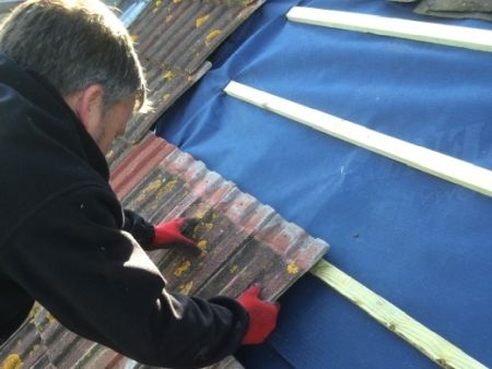 New replacement timber roofing battens and membrane fitted on tiled roof